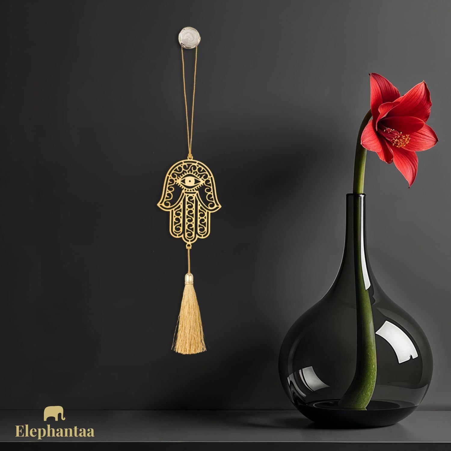 Elephantaa brass Hamsa Hand hanging decor with evil eye and tassel, bringing protection and good fortune.