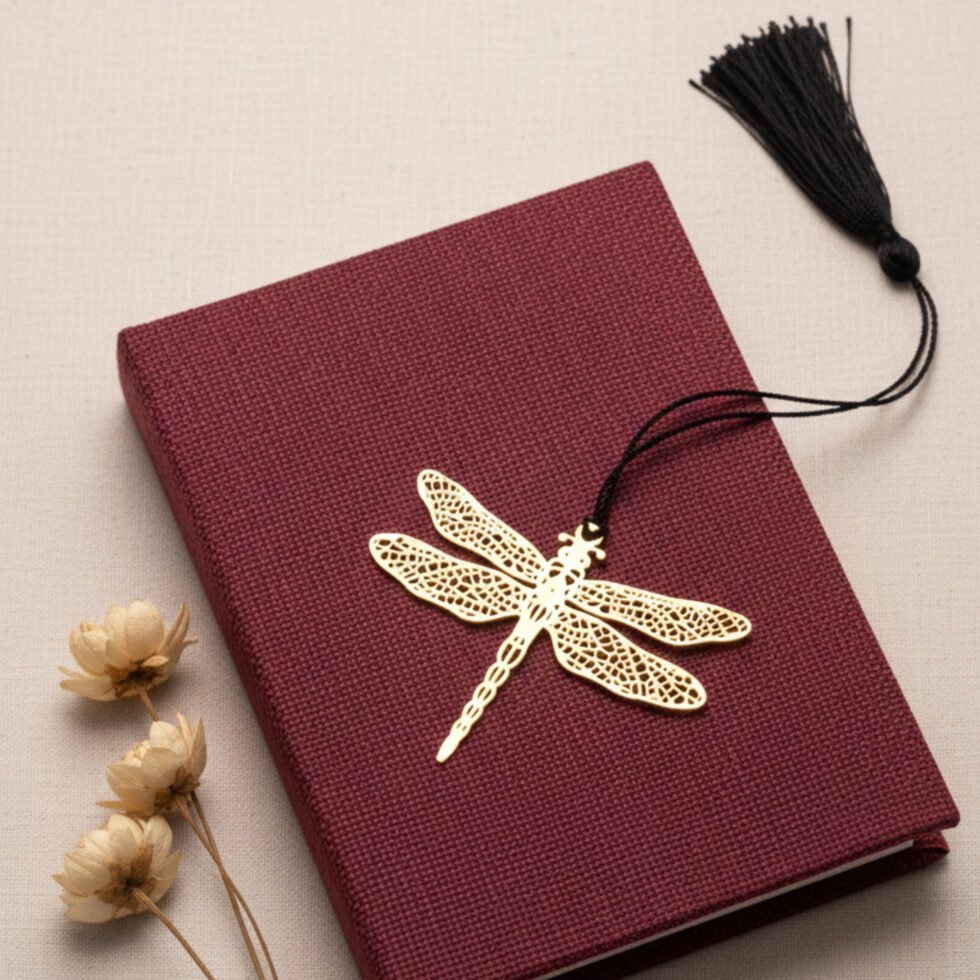 Dragonfly brass bookmark on maroon book warm tone aesthetic metal bookmark unique gift Indian gifts