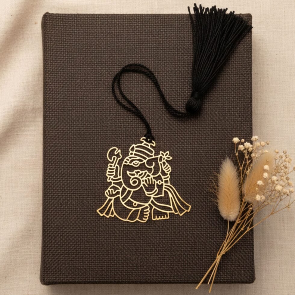 Ganesha brass bookmark on brown book natural aesthetic spiritual gift Indian gifts