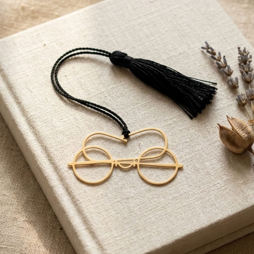 Gold plated brass Gandhi spectacles bookmark on khadi fabric book with dried flowers, handmade Indian gift aesthetic