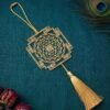 Gold plated brass Shree Yantra hanging decor on teal textured fabric with luxury spiritual styling by ELEPHANTAA
