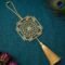 Gold plated brass Shree Yantra hanging decor on teal textured fabric with luxury spiritual styling by ELEPHANTAA